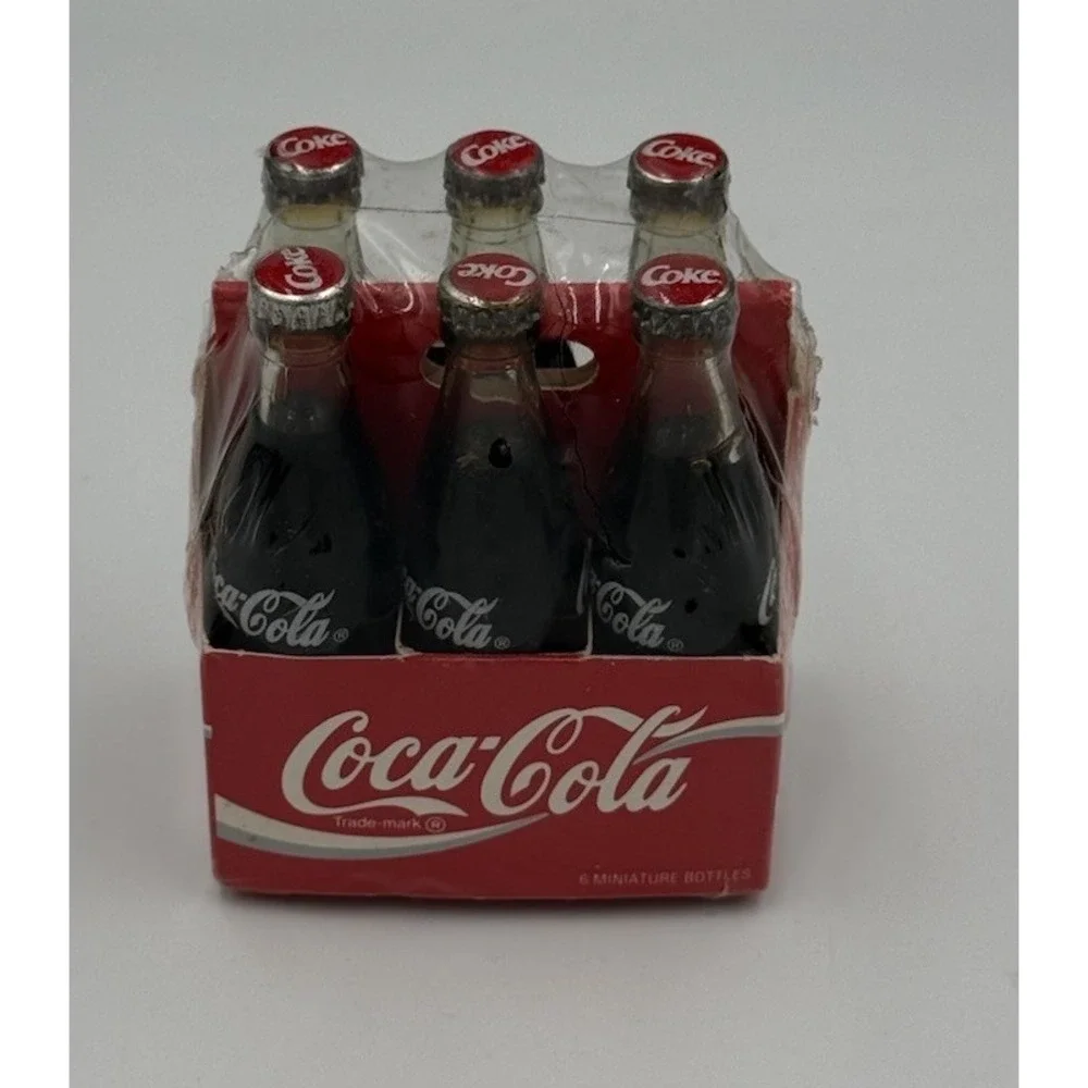 Vintage Miniature Six Pack of Glass Coca Cola Bottles In Paper Carrier Sealed